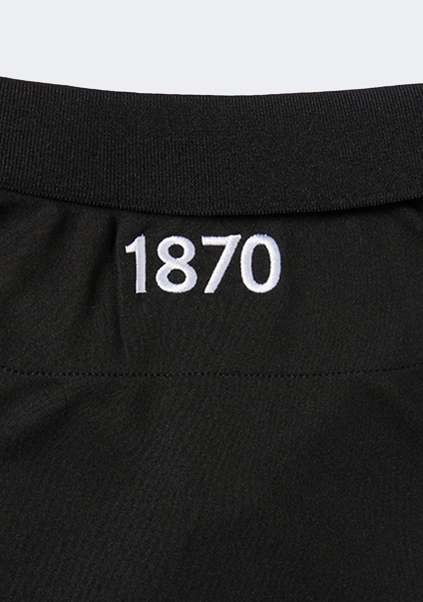 Macron Junior Port Adelaide M20 Travel Polo